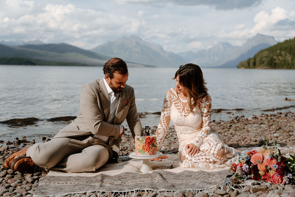 Private cake cutting at Lake McDonald during an adventurous elopement