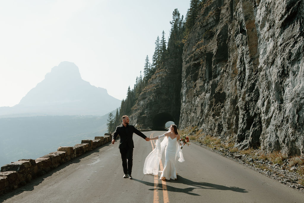 Newlyweds frolic along Going to the Sun Road following their intimate wedding ceremony